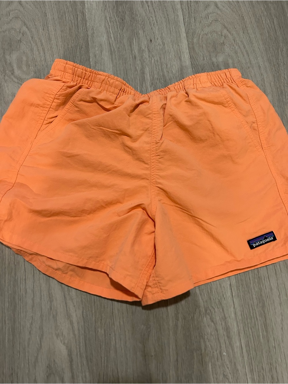 Patagonia women’s orange/peach colored baggies shorts, size small